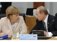 Bundeskanzlerin Angela Merkel im Gespräch mit dem russischen Präsident Wladimir Putin.
