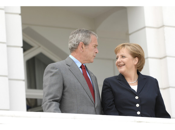 German Chancellor Angela Merkel and US President George W. Bush on their way to a bilateral working lunch in Heiligendamm