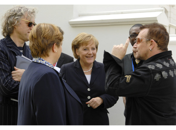 German Chancellor Angela Merkel meets Bono and Bob Geldof on the fringes of the G8 Summit in Heiligendamm