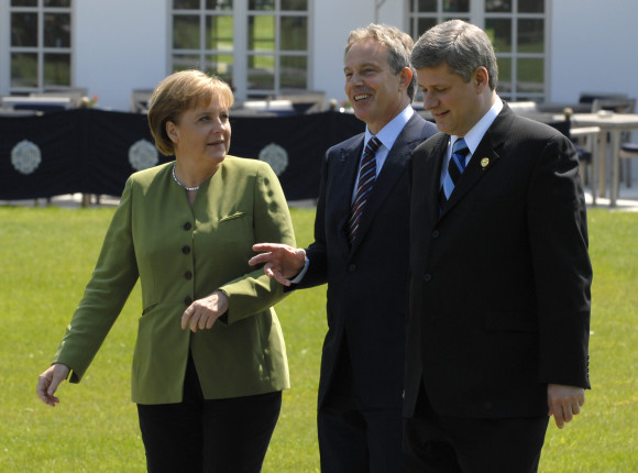 German Chancellor Angela Merkel talking to Tony Blair and Stephen Harper