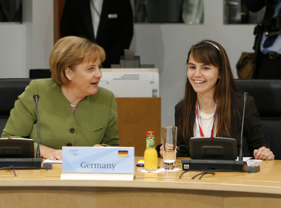 The G8 President Angela Merkel with her young delegate