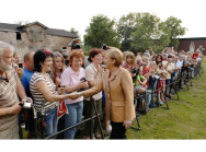 German Chancellor Angela Merkel greets inhabitants on the Hohen Luckow estate