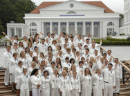 Pupils from the Fritz Reuter High School in Kühlungsborn, who will be working as press support staff during the G8 Summit, in front of the assembly rooms in Heiligendamm
