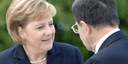 German Chancellor Angela Merkel talking to Italian Prime Minister Romano Prodi