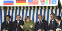 German Chancellor Angela Merkel sitting with the G8 Heads of State and Government in a wicker beach chair