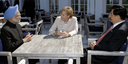 Before the meeting begins, German Chancellor Angela Merkel speaks with the Prime Minister of India, Manmohan Singh and the Chinese Prime Minister Wen Jiabao